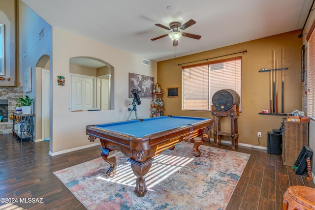 recreation room featuring baseboards, a fireplace, visible vents, and wood finished floors