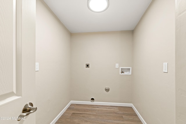 laundry room featuring hardwood / wood-style floors, electric dryer hookup, gas dryer hookup, and hookup for a washing machine