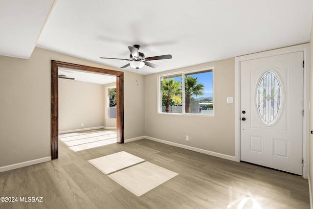 entrance foyer featuring light hardwood / wood-style flooring and ceiling fan