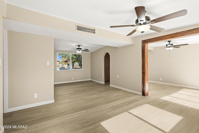 empty room featuring ceiling fan and wood-type flooring