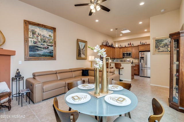 dining room featuring ceiling fan and light tile patterned floors