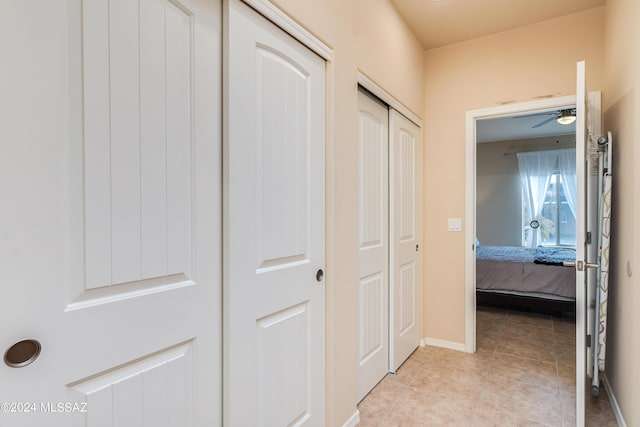 hallway featuring light tile patterned flooring