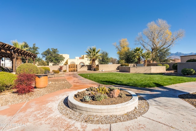 view of community featuring a yard and a pergola