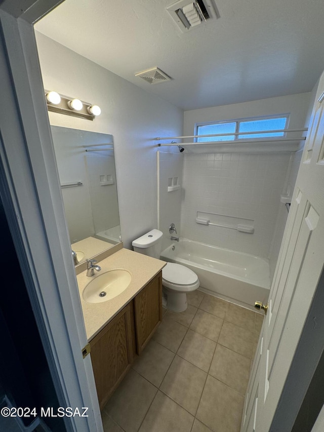 full bathroom featuring toilet, vanity, bathtub / shower combination, and tile patterned floors