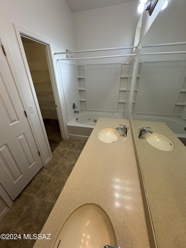 bathroom featuring vanity, tub / shower combination, and tile patterned floors