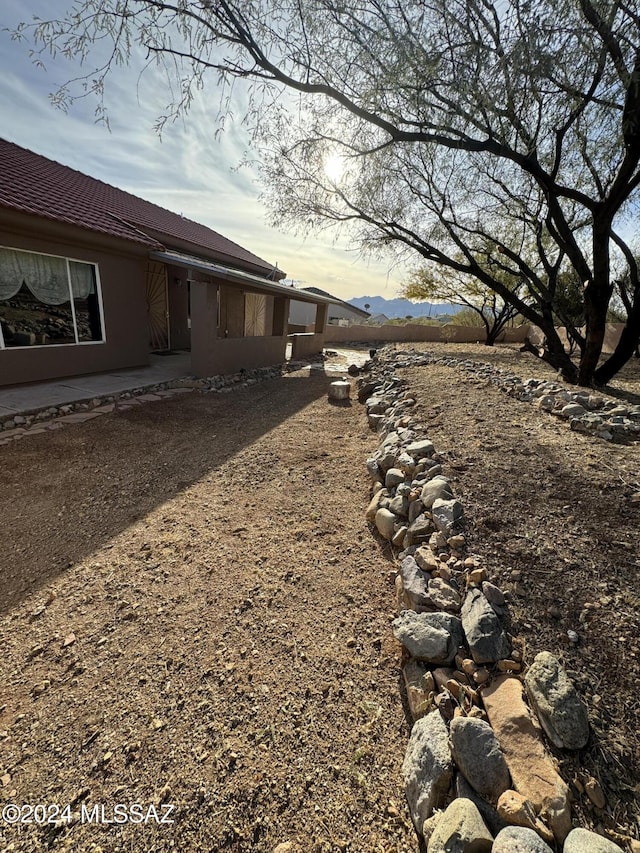 yard at dusk with a mountain view