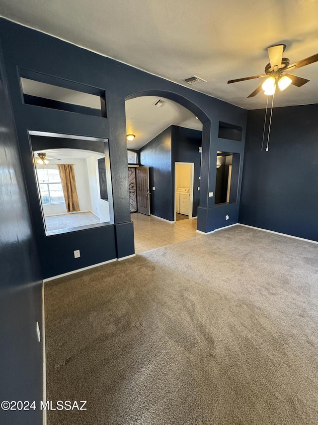 unfurnished room with ceiling fan and light colored carpet