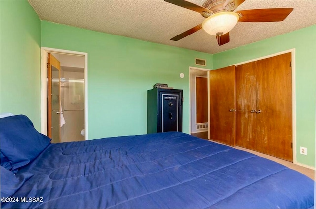 unfurnished bedroom featuring a textured ceiling, a closet, ceiling fan, and ensuite bathroom