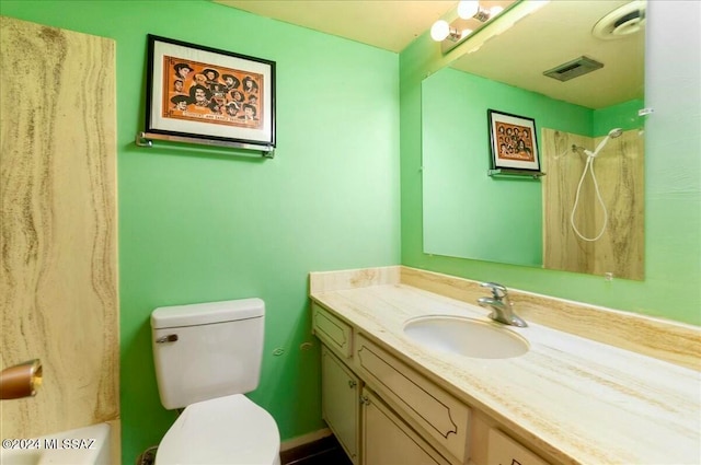 full bathroom featuring shower / tub combination, vanity, and toilet