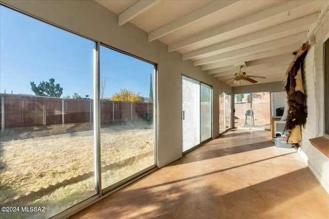 unfurnished sunroom with beam ceiling and ceiling fan