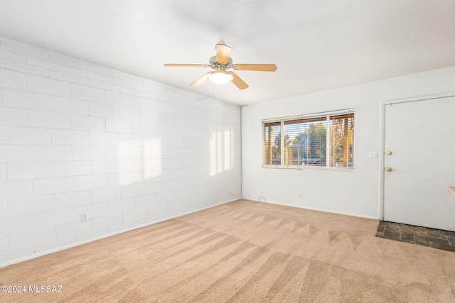 unfurnished room with light carpet and ceiling fan