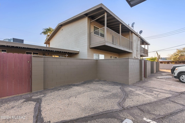 view of side of home with central AC unit