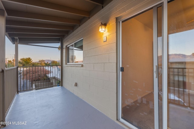 view of balcony at dusk