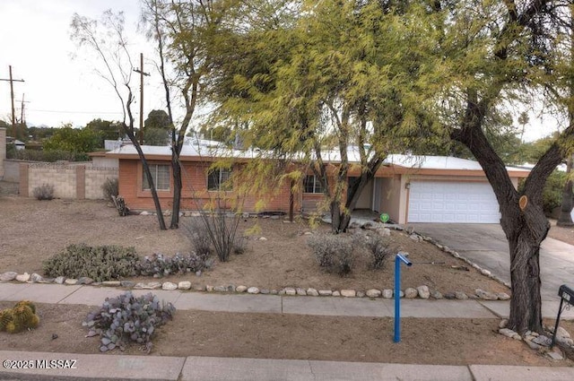 single story home featuring a garage