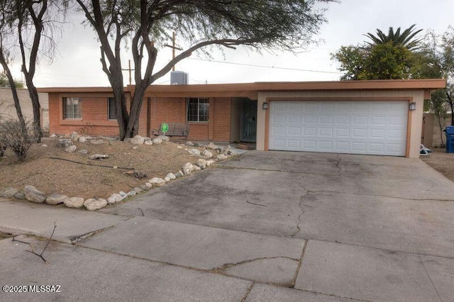 single story home with a garage