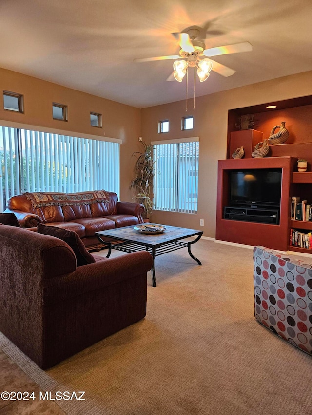 living room featuring ceiling fan and light colored carpet