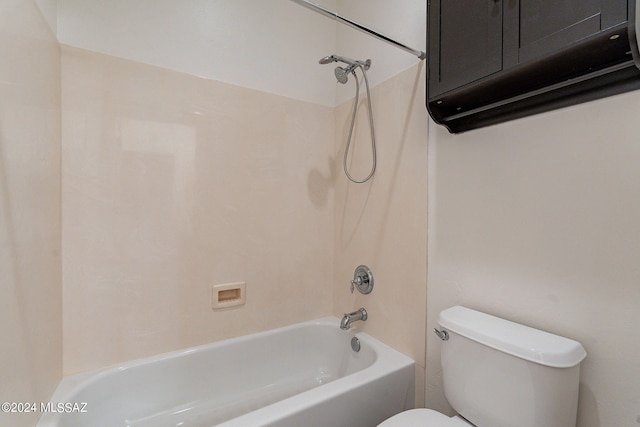 bathroom with toilet and bathtub / shower combination