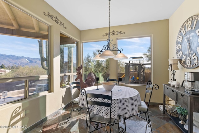 sunroom with a mountain view and a wealth of natural light