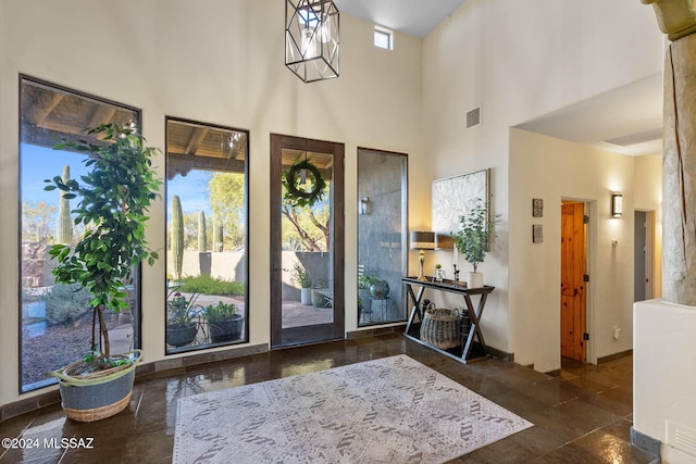 foyer entrance featuring a high ceiling