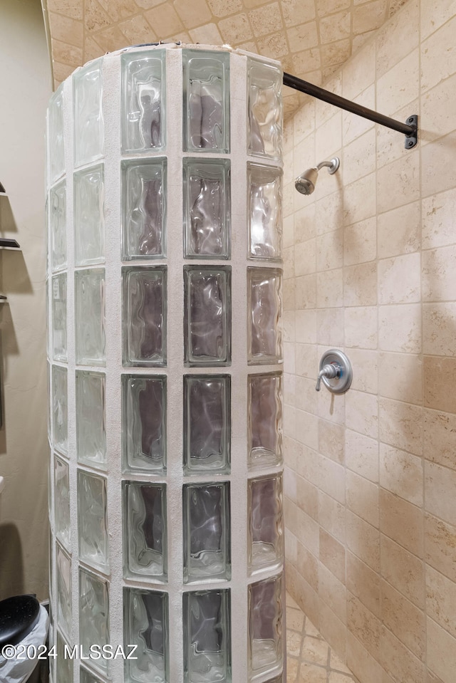 bathroom with a tile shower