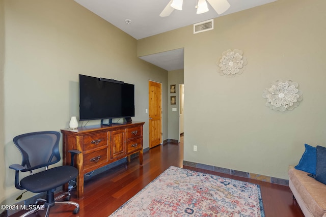 interior space featuring ceiling fan and dark wood-type flooring