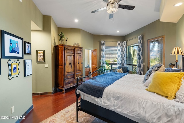 bedroom featuring dark hardwood / wood-style flooring and ceiling fan