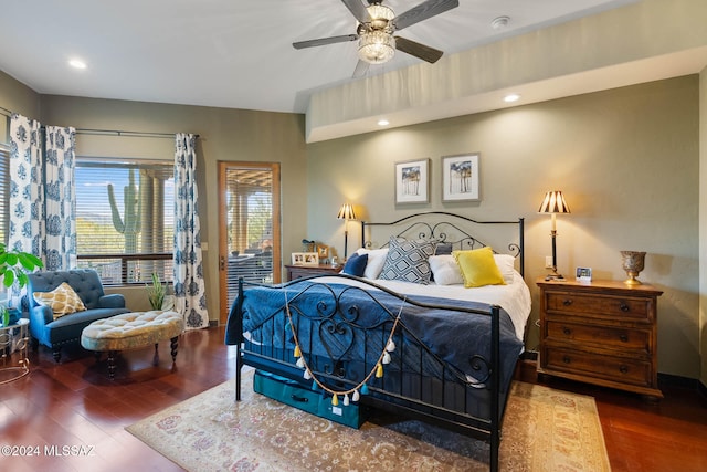 bedroom with access to exterior, ceiling fan, and dark hardwood / wood-style flooring