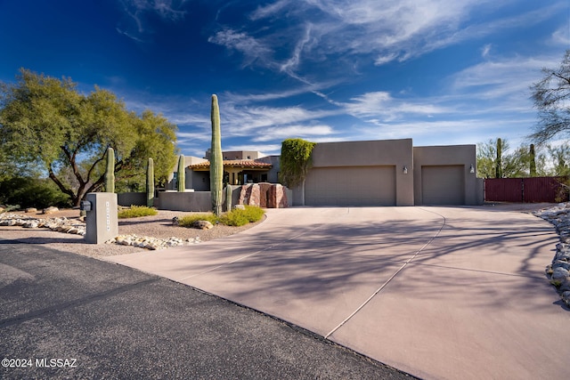 southwest-style home featuring a garage