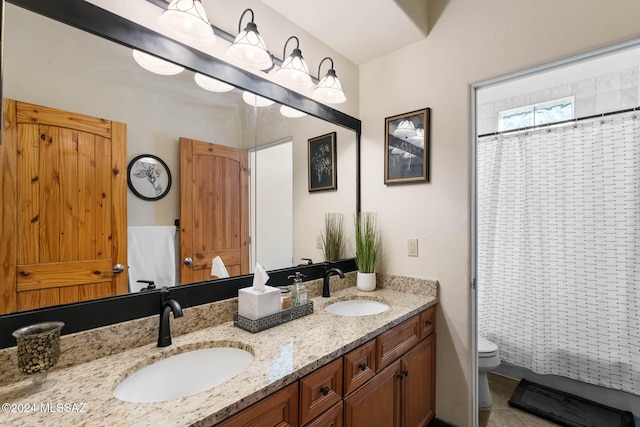 bathroom with a shower with curtain, vanity, toilet, and tile patterned flooring