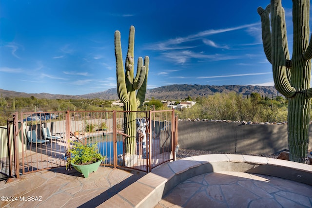 view of patio / terrace featuring a mountain view