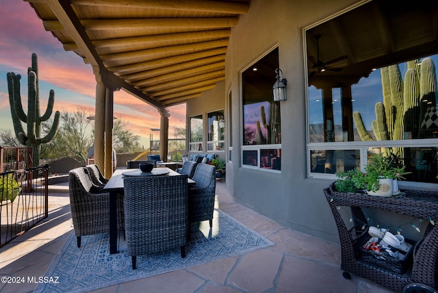 view of patio terrace at dusk