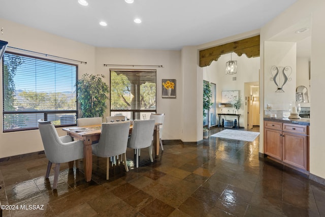 dining area featuring an inviting chandelier