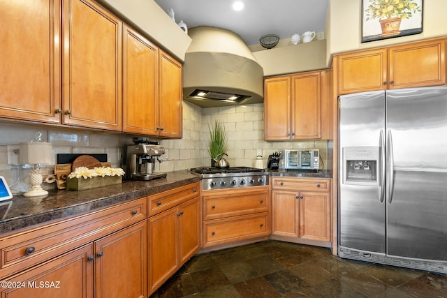 kitchen with tasteful backsplash, custom range hood, and appliances with stainless steel finishes