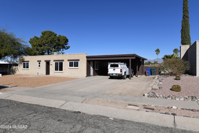 ranch-style home with a carport