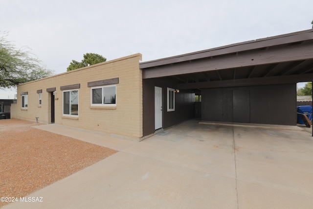 exterior space featuring a carport