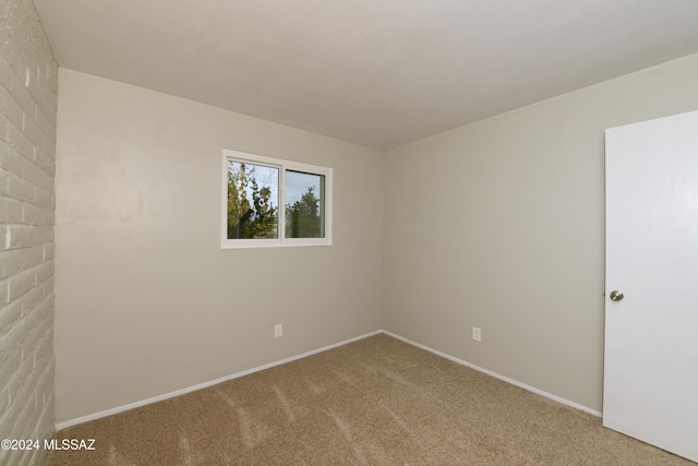 unfurnished room featuring carpet flooring