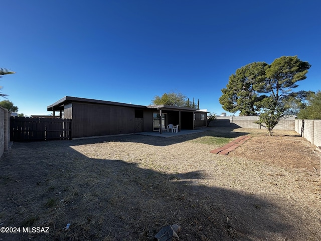 rear view of property with a patio area