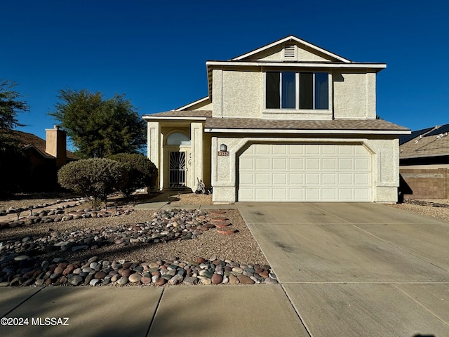 view of front of property featuring a garage