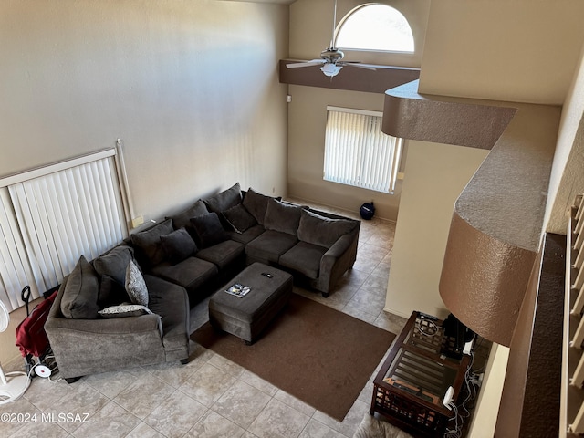 living room with light tile patterned floors and ceiling fan