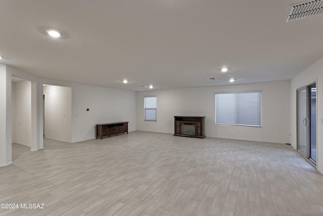 unfurnished living room with light wood-type flooring