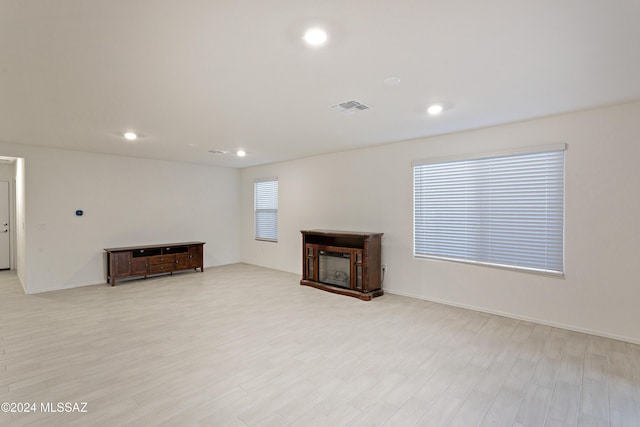 unfurnished living room with light hardwood / wood-style floors