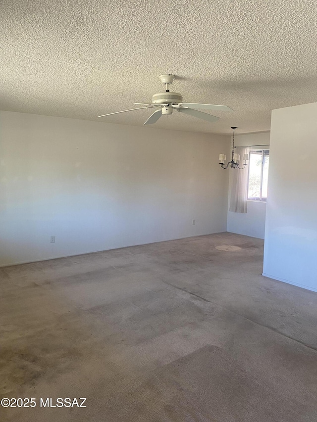 empty room with a textured ceiling and a ceiling fan