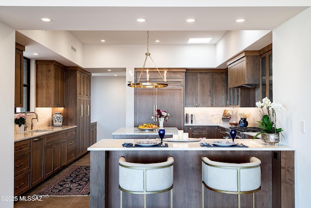 5200 N Camino Antonio, Tucson, AZ 85718 - kitchen featuring backsplash, recessed lighting, and a sink