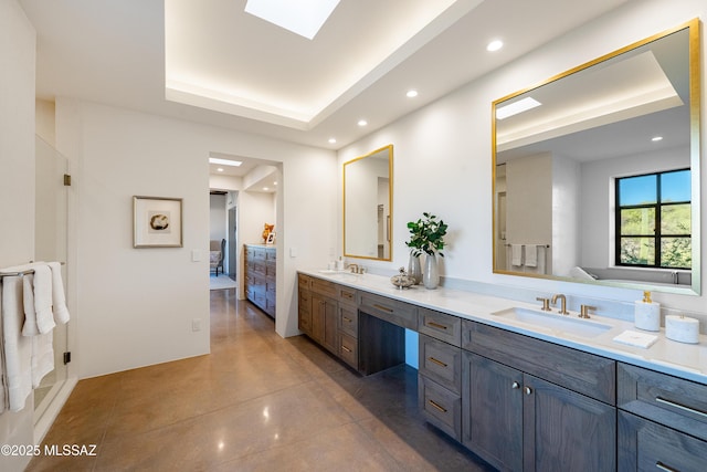 5200 N Camino Antonio, Tucson, AZ 85718 - ensuite bathroom featuring ensuite bathroom, finished concrete floors, a sink, and a tray ceiling
