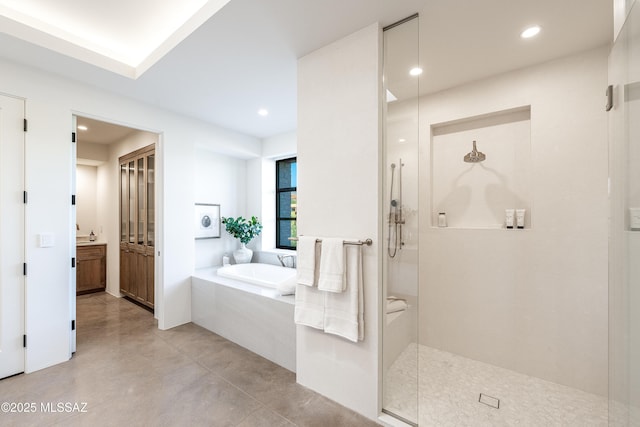 5200 N Camino Antonio, Tucson, AZ 85718 - bathroom featuring recessed lighting, a bath, vanity, a stall shower, and concrete flooring