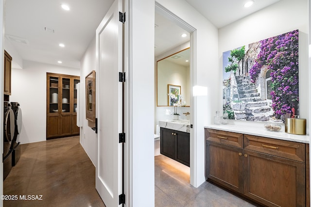 5200 N Camino Antonio, Tucson, AZ 85718 - corridor with concrete floors, recessed lighting, and washing machine and dryer