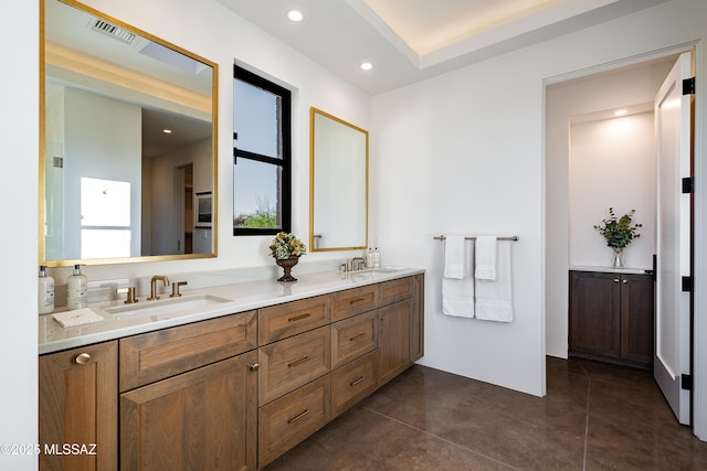 5200 N Camino Antonio, Tucson, AZ 85718 - bathroom featuring recessed lighting, double vanity, a sink, and visible vents