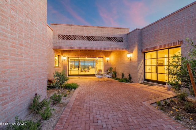 5200 N Camino Antonio, Tucson, AZ 85718 - property entrance featuring a patio area and brick siding
