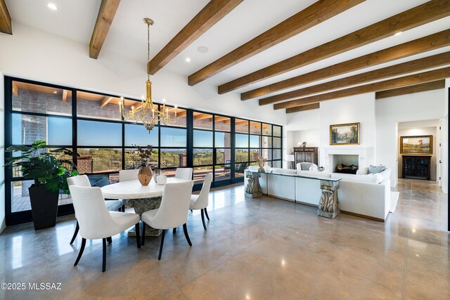 5200 N Camino Antonio, Tucson, AZ 85718 - dining room featuring recessed lighting, beam ceiling, a fireplace, a notable chandelier, and concrete floors