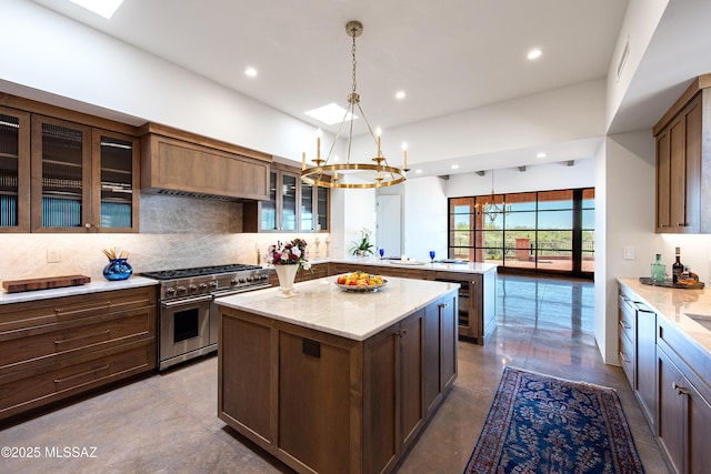 5200 N Camino Antonio, Tucson, AZ 85718 - kitchen with recessed lighting, decorative backsplash, a peninsula, a kitchen island, and double oven range